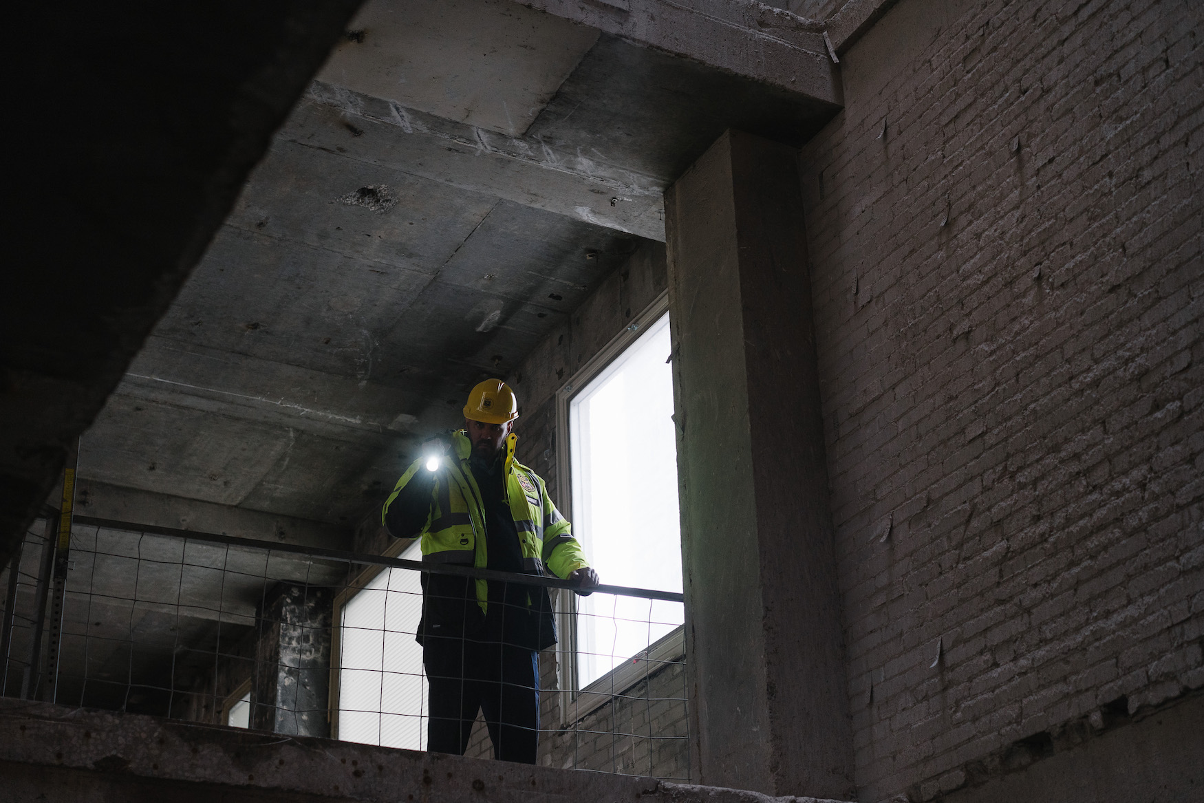 Construction site security guard inspecting