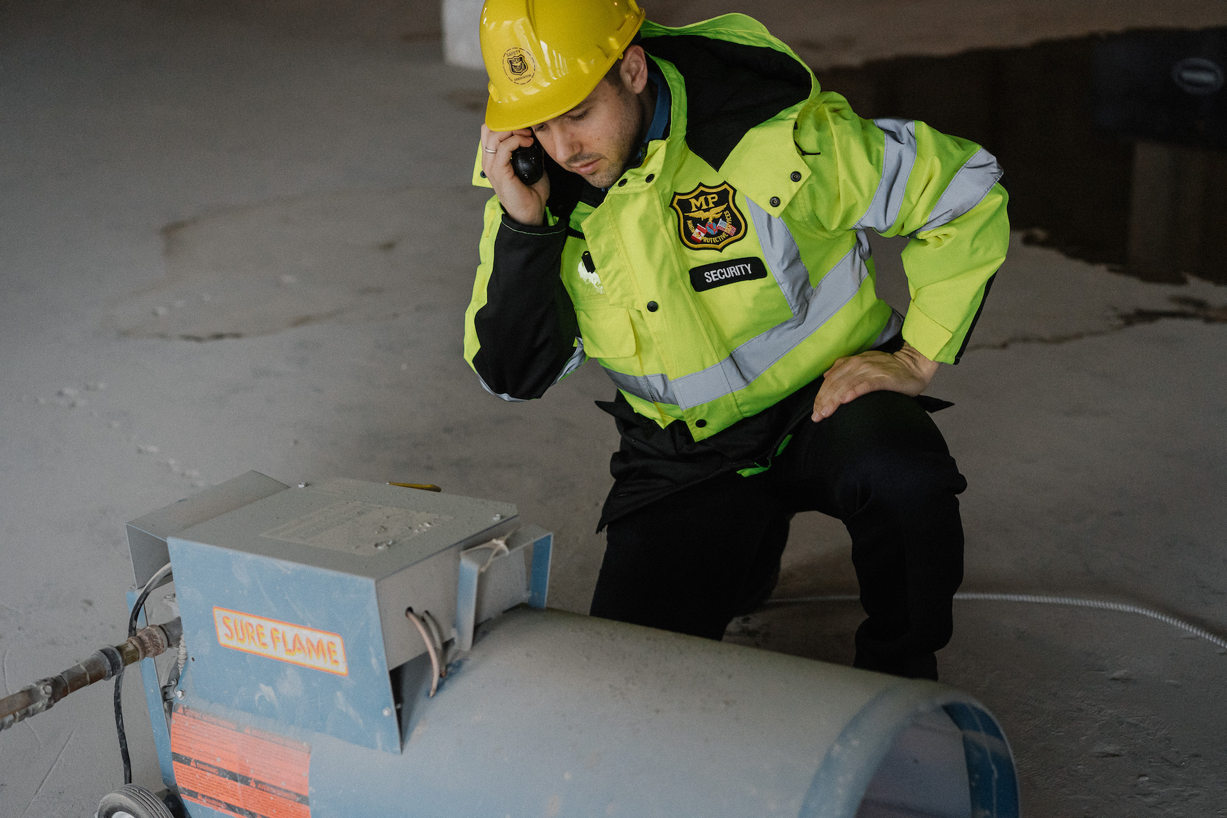 Fire watch guard on phone during inspection